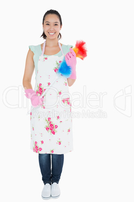 Woman standing with duster