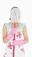 Woman hiding her face with a mop