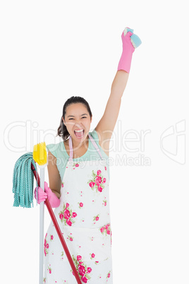 Shouting woman holding a sponge in the air