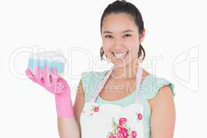 Smiling woman holding a sponge