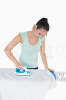Woman ironing a shirt