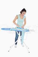 Woman ironing a jumper