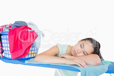Woman sleeping on an ironing board