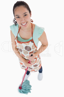 Pretty woman mopping the floor