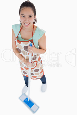 Woman sweeping the floor