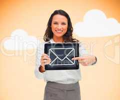 Woman standing holding a tablet pc with a message symbol