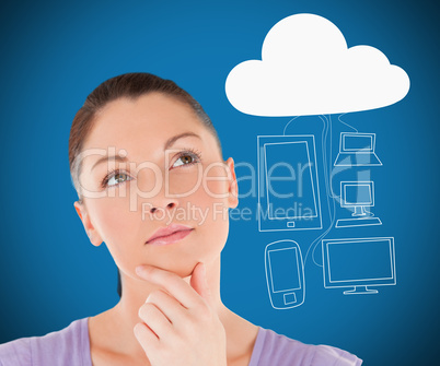 Woman thinking about media devices connecting through cloud comp