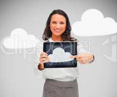 Businesswoman holding a tablet pc showing cloud symbol