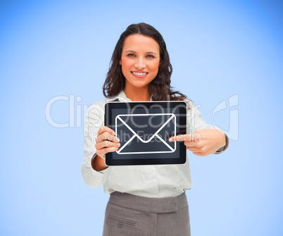 Businesswoman smiling and pointing to mail symbol