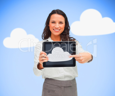 Woman standing holding a tablet pc showing cloud computing symbo
