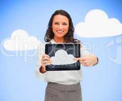 Woman standing holding a tablet pc showing cloud computing symbo