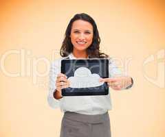 Woman pointing to cloud symbol on her digital tablet