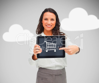 Businesswoman holding a tablet pc with shopping symbol