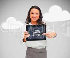 Businesswoman holding a tablet pc with shopping symbol