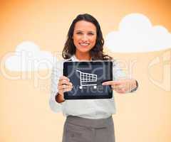 Businesswoman holding a tablet pc showing a shopping symbol