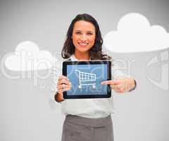 Woman standing holding a digital tablet with shopping app