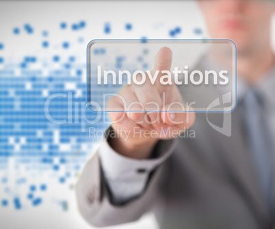 Businessman standing while pointing to the word innovation