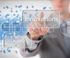 Businessman standing behind the word innovation