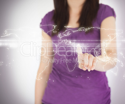 Woman standing using world map projection