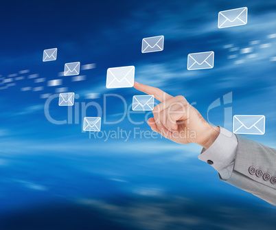 Businessman pointing at a message symbol