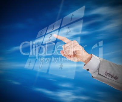 Businessman entering code on holographic number pad