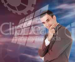 Businessman standing smiling with holographic number pad