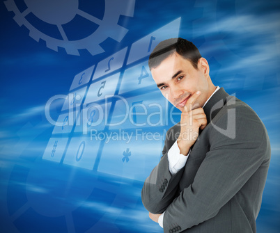 Businessman standing against blue background