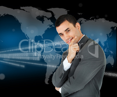 Businessman standing in front of world map