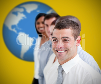 Businesspeople standing and smiling against yellow background