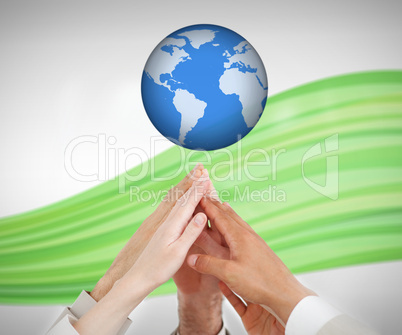 People reaching hands to globe