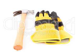 Pair of builder's gloves and hammer