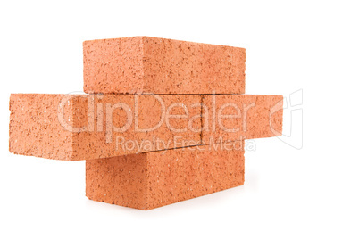 Four clay bricks stacked as a part of a wall