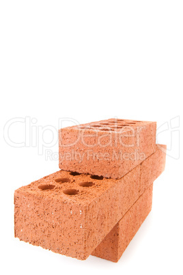 Four clay bricks from the side stacked as a wall