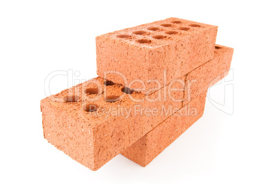 Four red bricks stacked as a part of a wall