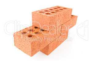 Four red bricks stacked as a part of a wall