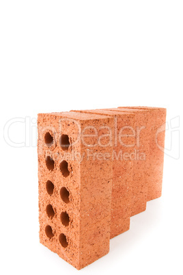 Four clay bricks positioned in a row