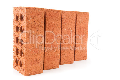 Four red bricks positioned in a row