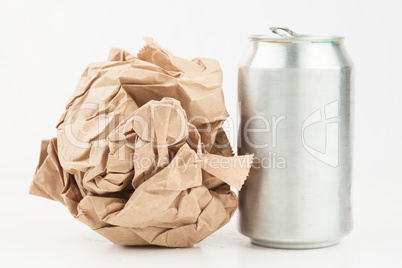Empty can and crushed paper bag