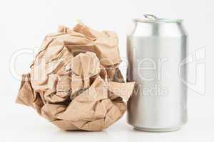 Empty can and crushed paper bag