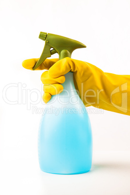 Hand using spray bottle