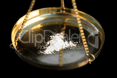 White illegal substance being weighed