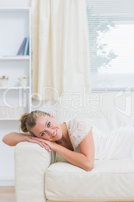 Blond woman lying on the couch