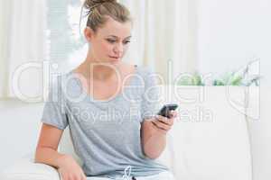 Woman texting with mobile phone