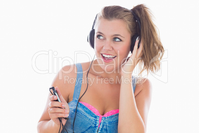 Eighties styled woman listening to music