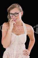 Woman with glasses chewing on finger