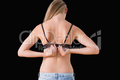 Woman opening her bra