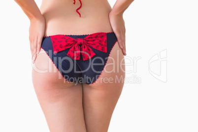 Woman at rear wearing bikini briefs