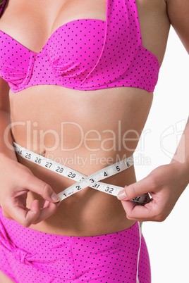 Woman measuring her stomach