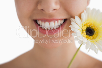 Smiling woman with a flower