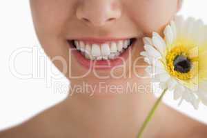 Smiling woman with a flower